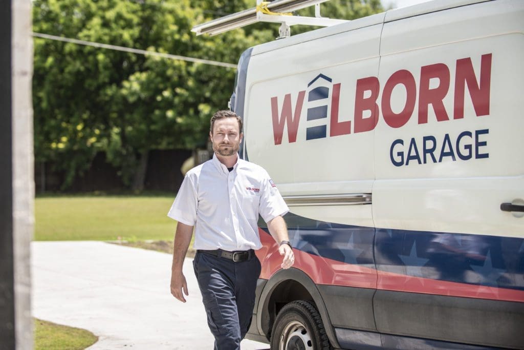 tech walking from Welborn truck towards customer